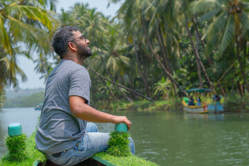 Naklejka na ściany i meble indian tourist on boat in sharavati river in udupi