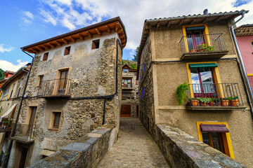 Old construction houses next to the stone bridge of the picturesque town of Camprodon, Pyrenees, Girona.