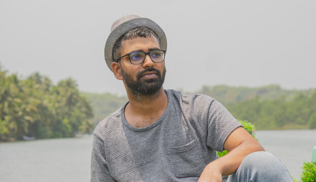 Young tourist sightseeing in honnavar river