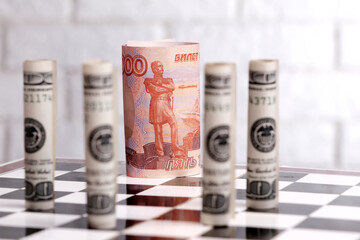 Russian rubles and American dollars on a chessboard