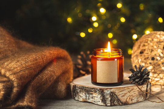Christmas Holiday burning candle in a glass jar