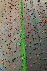 Artificial rock climbing wall showing various colored grips