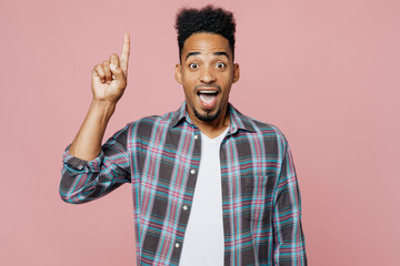 Young proactive man of African American ethnicitywear blue shirt holding index finger up with great...