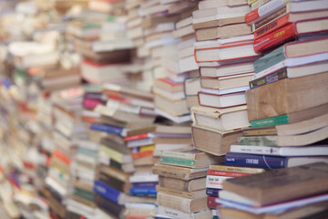 Vintage Books in an old Library Bookshop Stacked on top of each other in piles Reading 