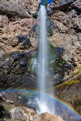 Scenic view of Treasure Falls in bright sunlight in Pagosa Springs, Colorado, Vertical shot