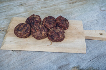 ready to eat - grilled venison burger from a charcoal grill