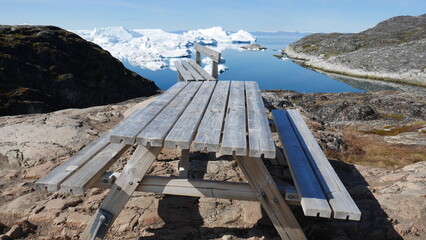 Bench with scenic view over icebergs in Greenland