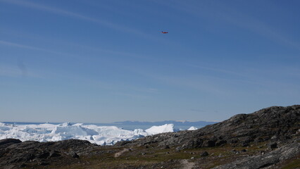 Aircraft flies over icebergs in Greenland
