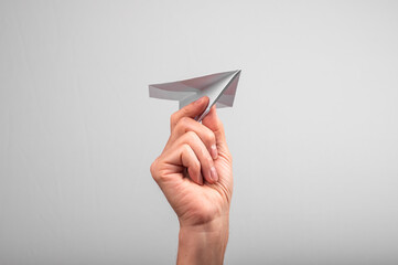 Origami paper plane in hand. Sending message, starting business, startup project concept