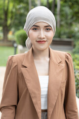 Confident woman cancer patient having chemotherapy and radiation therapy treatment adverse effect,...