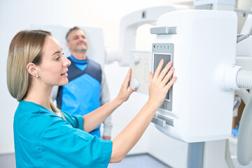 Smiling patient waiting for the x-ray machine to turn on