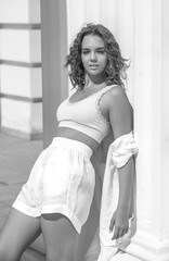 Portrait of a young beautiful curly blonde model