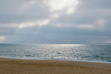 Grey ocean seaside with bad weather at evening time in Capbreton, France