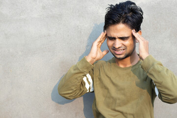 Young indian man having brain disease. concept of brain hemorrhagic stroke