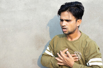 young Indian having heart attack