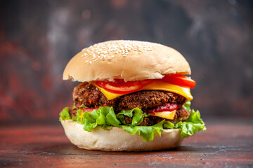 front view tasty meat burger with cheese and salad on dark background bun sandwich fast-food
