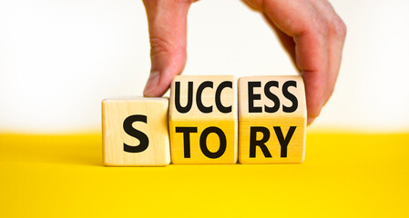 Success story symbol. Concept words Success story on wooden cubes. Businessman hand. Beautiful...