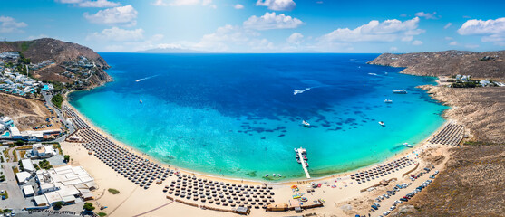 Panoramic aerial view of the popular Elia beach at the island of Mykonos, Cyclades, Greece, during summer time