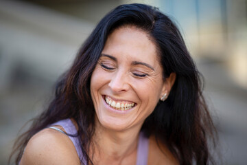 Joyful mature woman with her eyes closed