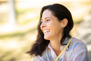 Portrait of joyful caucasian woman laughing