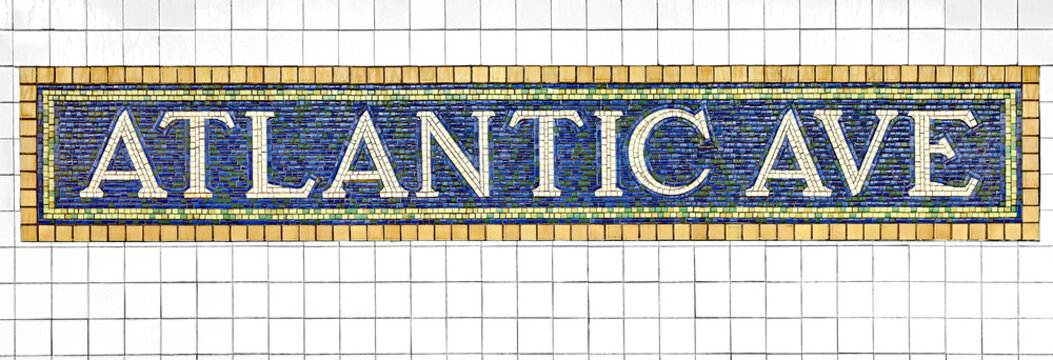 sign pointer at the entrance to the subway