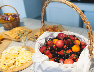 Catering banquet table, beautifully decorated with variety selection of different food snacks and appetizers on a corporate birthday party event or wedding celebration, delicatessen setting