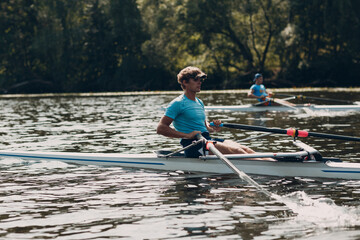 Sportsman single scull man rower rowing on boat.