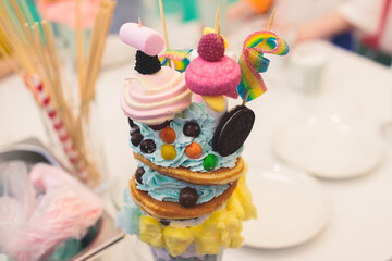 Over shake and freak shake, process of cooking extreme colorful milkshakes on a kids birthday party...