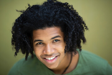 Face of smiling black man with curly hair