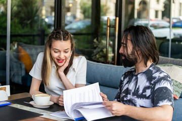 Sweet lady looking at her friends notes