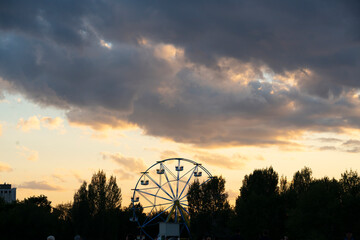 Nursultan, Kazakhstan, August 2022. Ferris wheel against the sunset sky. High quality photo