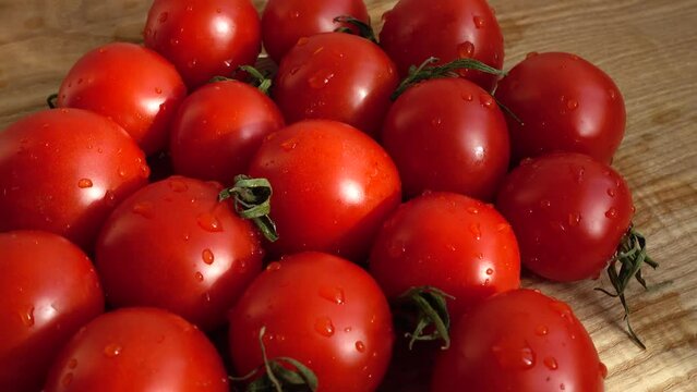 Cheries tomatoes. Shooting in the movement.