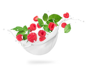 Raspberry with leaves in milk splashes close-up isolated on a white background