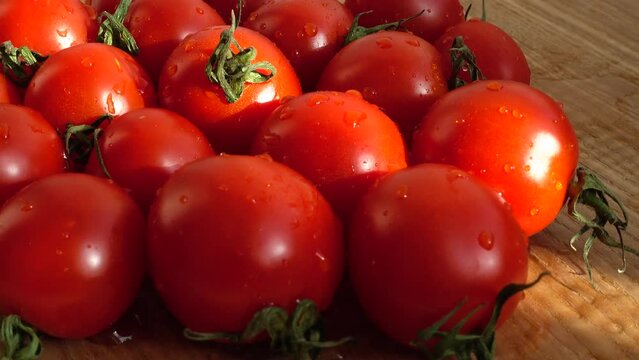Cheries tomatoes. Shooting in the movement.
