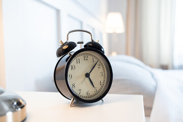 vintage alarm clock in bright bedroom