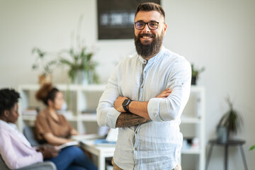 Portrait of young office worker in his office.