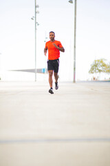 Obraz premium Fit african american man jogging in city