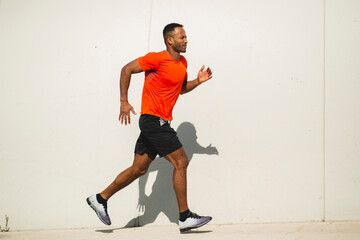 Man jogging outdoors on a bright sunny day