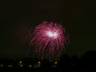 Colorful holiday fireworks and night sky background.