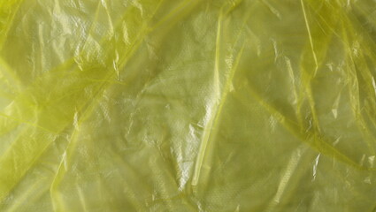 Yellow wrinkled plastic bag texture and background
