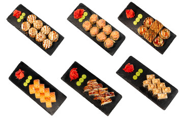 isolated set of 3 different types of sushi on a black marble board for your menu. Sashimi. Nigiri....