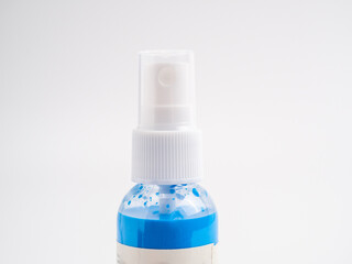 Vials of acrylic spray paint on a white background. Close-up.