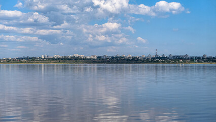 Seascape Sea with calm water and white clouds