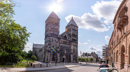 Fototapeta na wymiar Lund, Sweden - July 2021: Lund Cathedral and bell tower building in central Lund on a summer day, Sweden, south of Lund Cathedral in Skane.