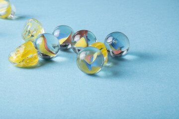 glass marbles on a blue background