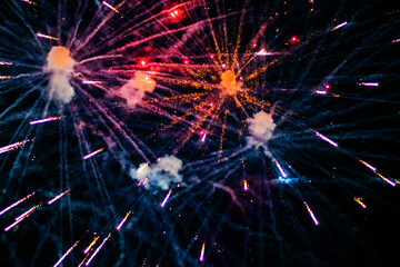 Beautiful multi-colored fireworks against the background of the night sky.