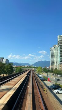Train is traveling on road Fast shooting towards another skytrain coming from front window this is driverless subway train is coming from Surrey video is visible All around. canada Vancouver 07.2022