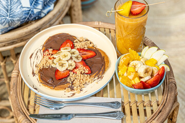 Pancakes with smoothie and fruit salad