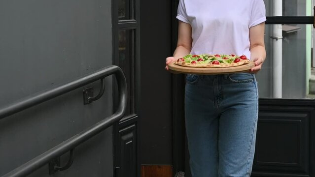 The woman has no money to pay for food. pulls empty pockets