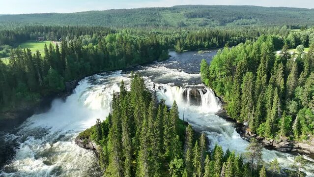 Picturesque view of a Swedish picturesque landscape with waterfalls, rapids and evergreens